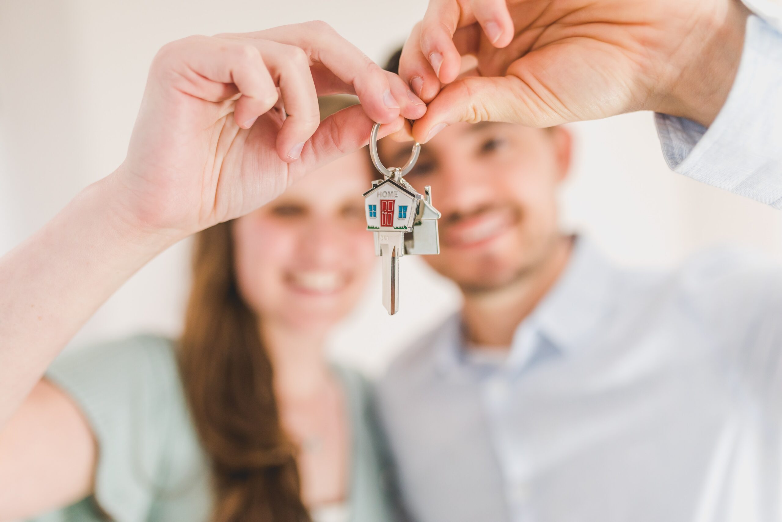 Image of a couple holding a new set of house keys 